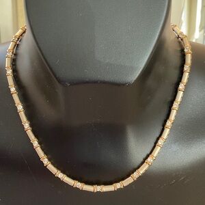 Sophisticated Gold and Silver Necklace with Crystal Details